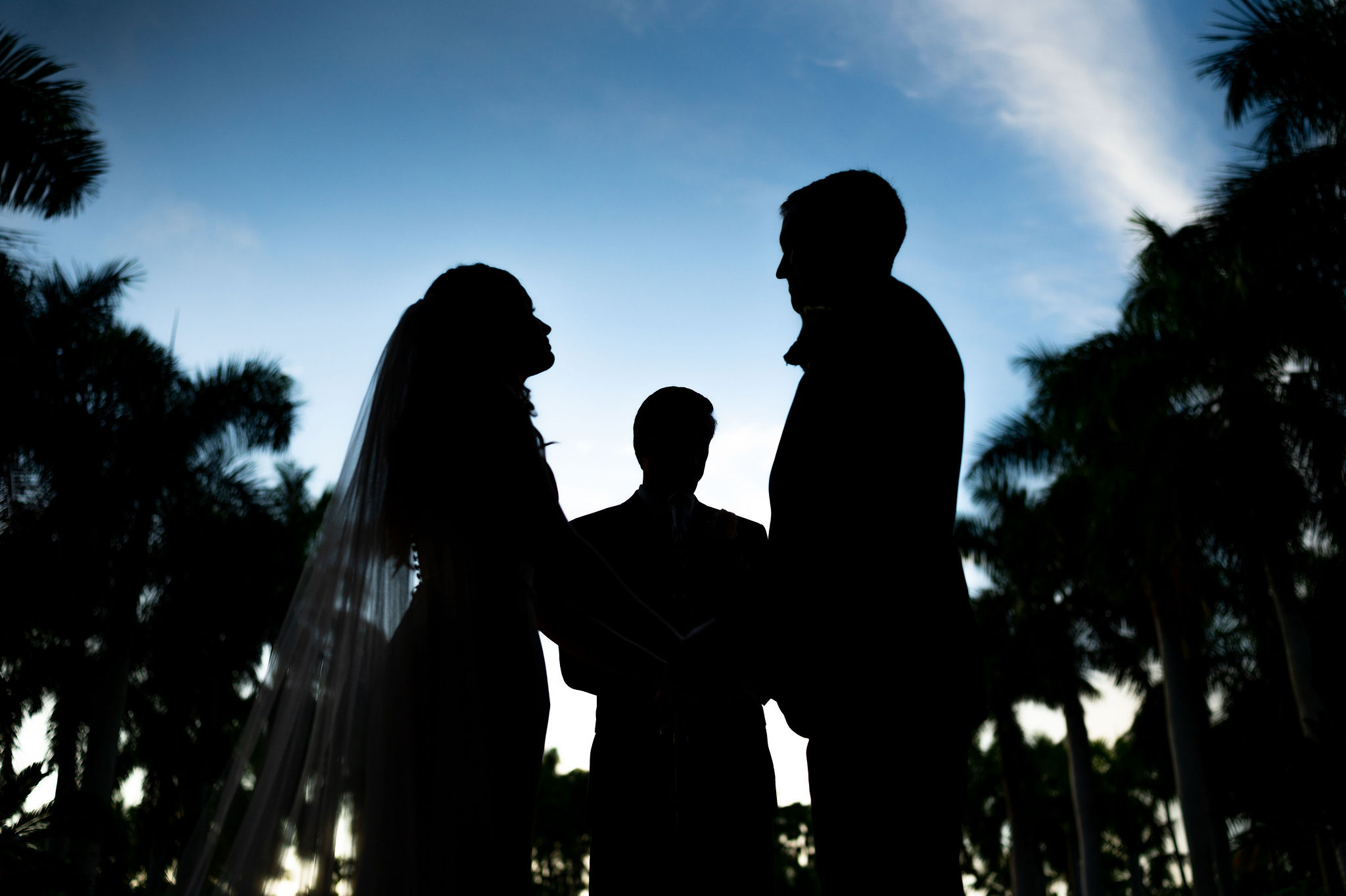 bride and groom silhouette during their wedding ceremony