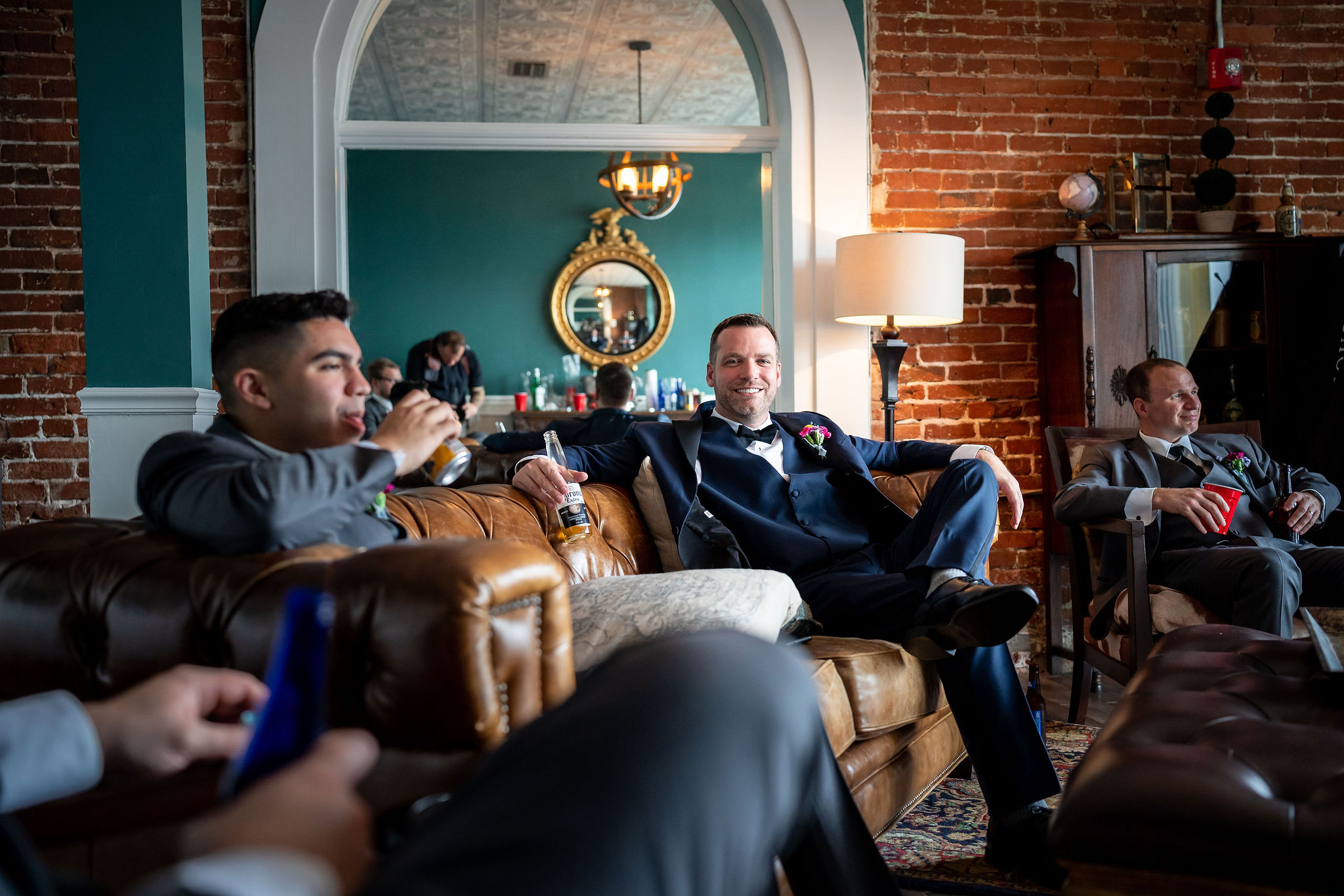 groom hanging out with his groomsmen