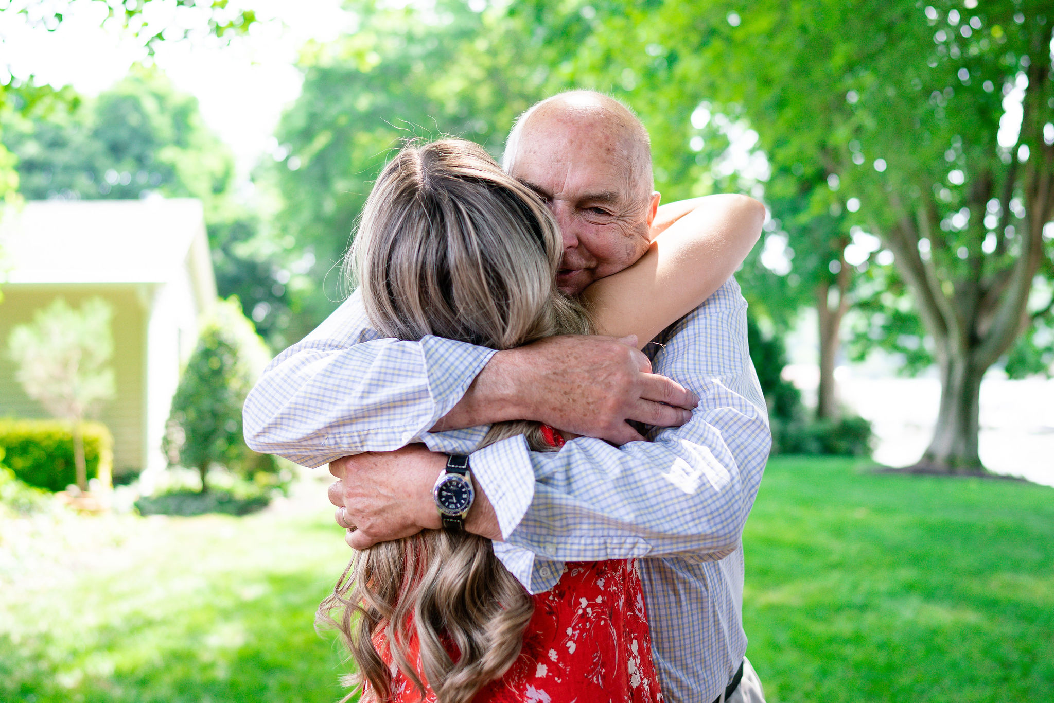 girl hugging her grand dad