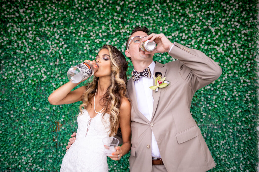bride and groom drinking