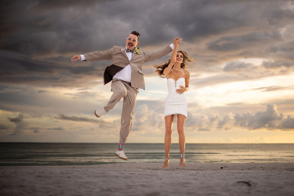 bride and groom jumping