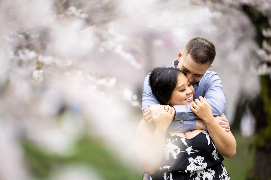 couple holding each other during the DC cherry blossom festival