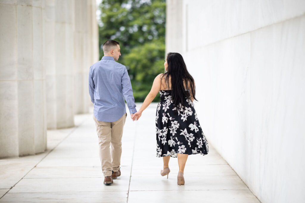 couple walking and holding hands in dc