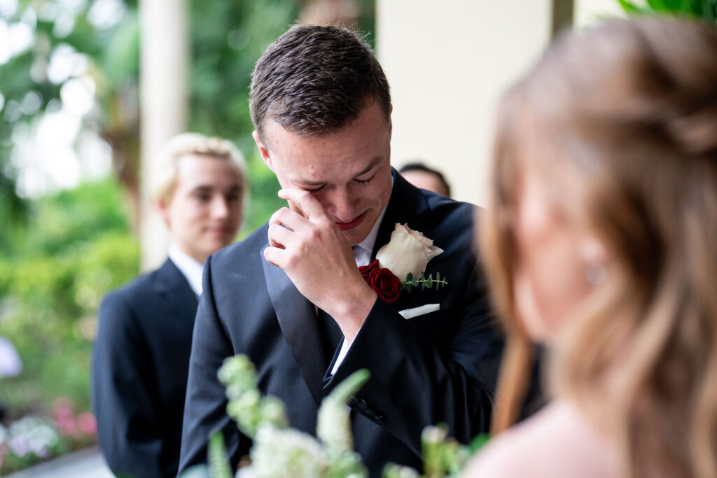 groom crying during wedding ceremony